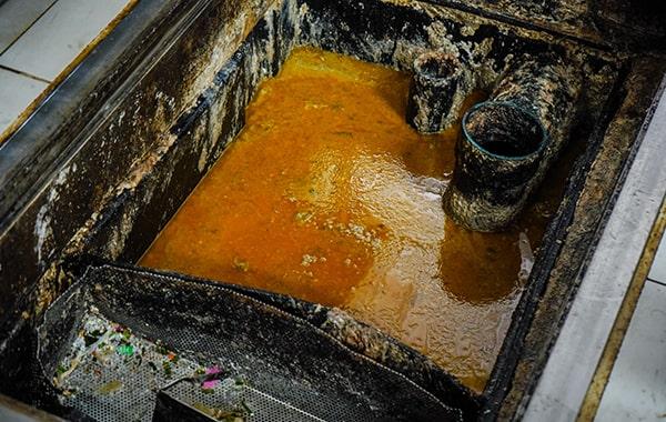 neglecting grease trap cleaning can result in clogs, foul odors, and even fines from local authorities